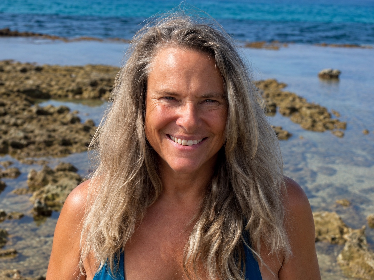 Audrey Holmes smiling at the water's edge